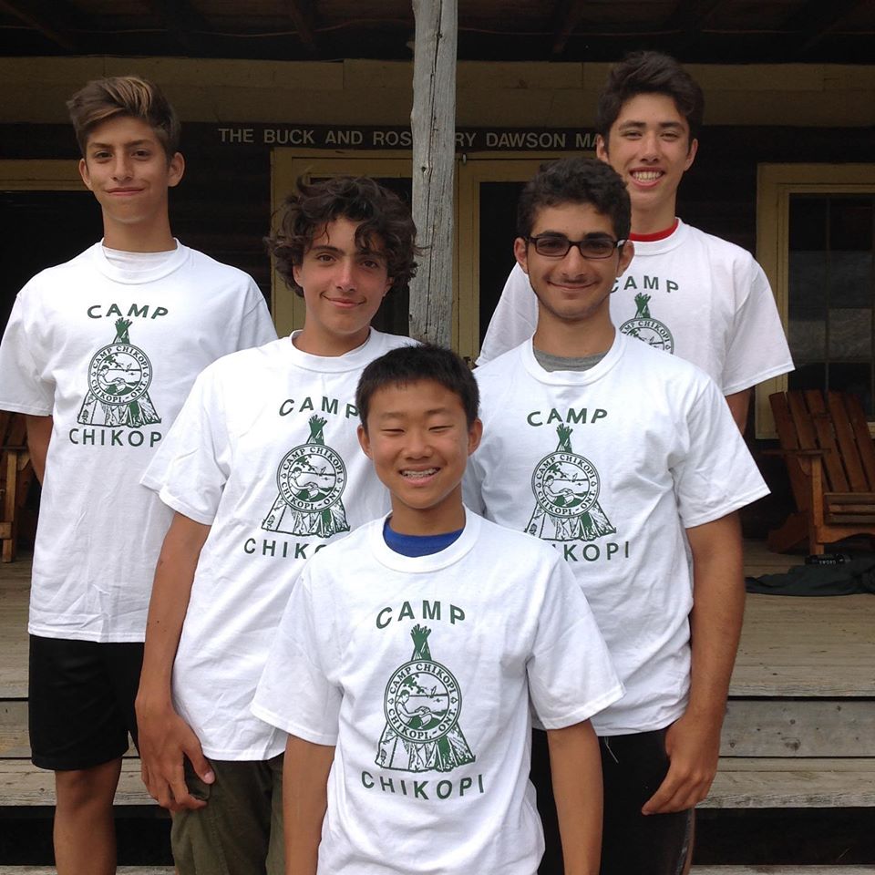 Young boy campers posing in their Camp Chikopi tshirts